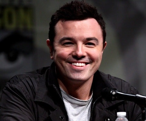 Seth Woodbury MacFarlane wearing a white t-shirt and black jacket.